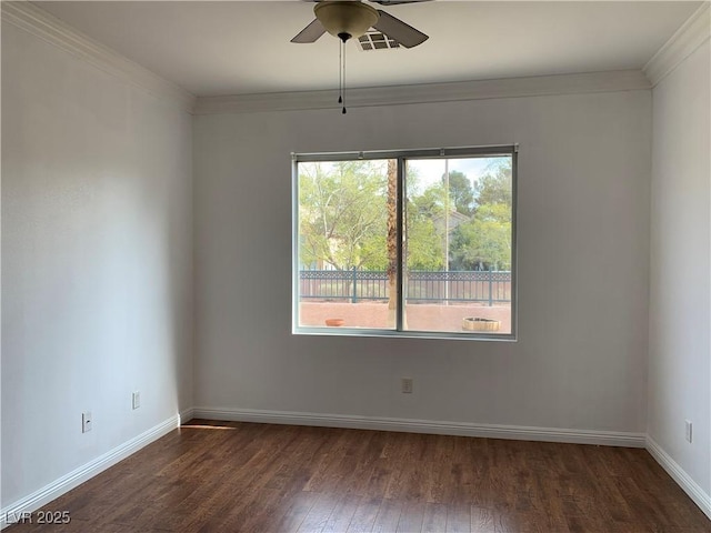 9236 Canalino Dr, Las Vegas, NV 89134 - spare room featuring dark wood-style floors, a ceiling fan, baseboards, and crown molding