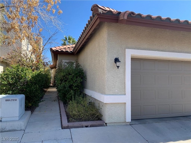 9236 Canalino Dr, Las Vegas, NV 89134 - view of property exterior featuring a tiled roof and stucco siding