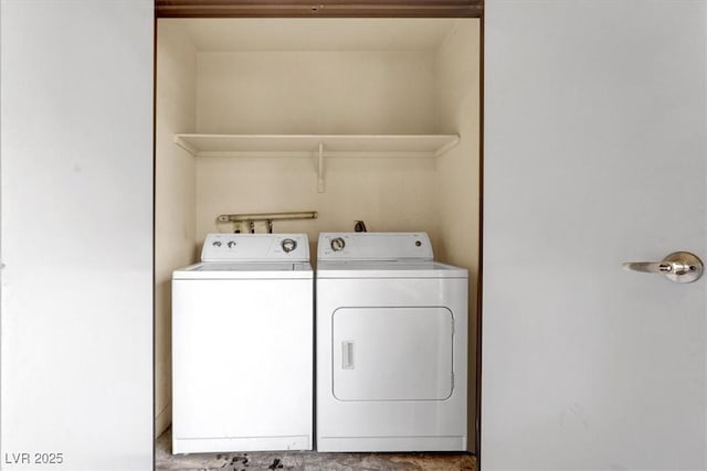 washroom featuring washer and clothes dryer