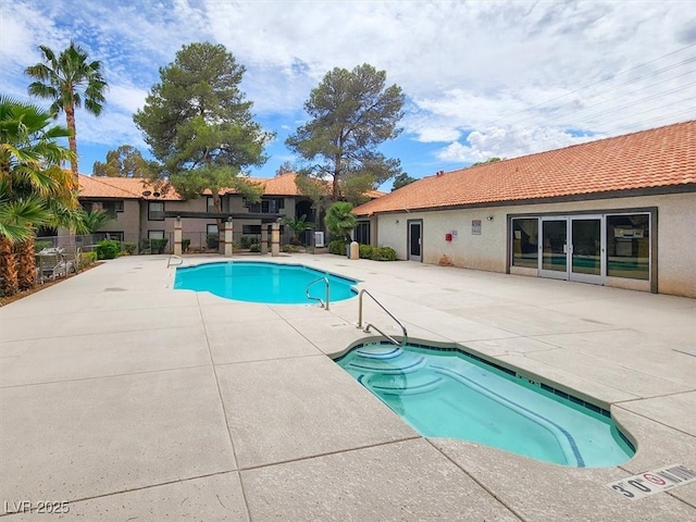 community pool with a patio