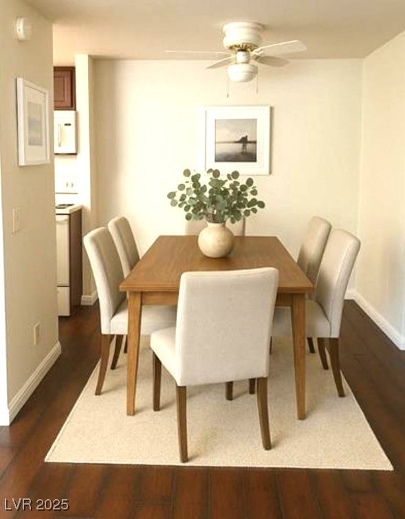 dining space with baseboards, dark wood finished floors, and a ceiling fan
