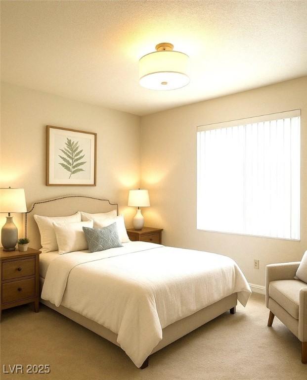 bedroom featuring light colored carpet
