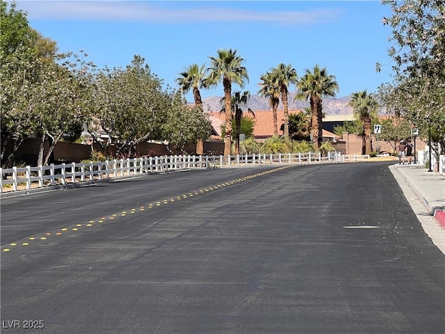 8688 Tomnitz Ave Unit 101, Las Vegas, NV 89178 - view of asphalt street featuring curbs, a residential view, and sidewalks