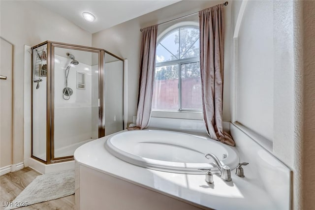1033 Logan Patrick Dr, Henderson, NV 89052 - full bath with a shower stall, a bath, and wood finished floors