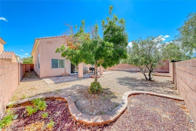 1033 Logan Patrick Dr, Henderson, NV 89052 - back of house with stucco siding, a fenced backyard, and a patio area