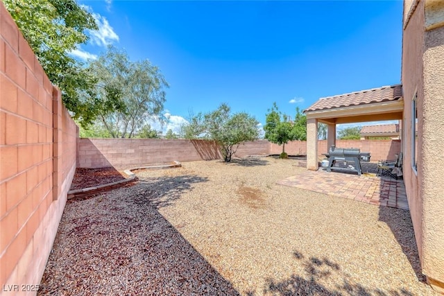1033 Logan Patrick Dr, Henderson, NV 89052 - fenced backyard with a patio area