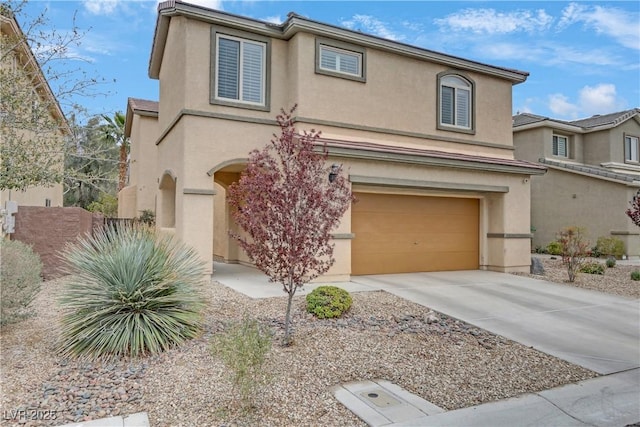 traditional-style home featuring an attached garage, stucco siding, and concrete driveway