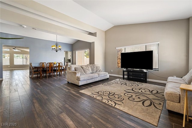 5912 Hollowridge Rd, North Las Vegas, NV 89031 - living room featuring vaulted ceiling, dark wood-type flooring, a chandelier, plenty of natural light, and baseboards