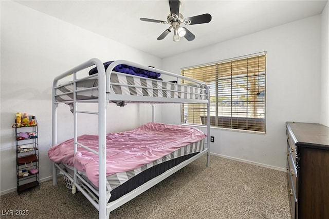 5912 Hollowridge Rd, North Las Vegas, NV 89031 - carpeted bedroom with baseboards and a ceiling fan