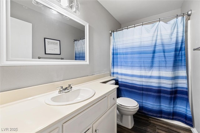 5912 Hollowridge Rd, North Las Vegas, NV 89031 - full bathroom with wood finished floors, vanity, and toilet