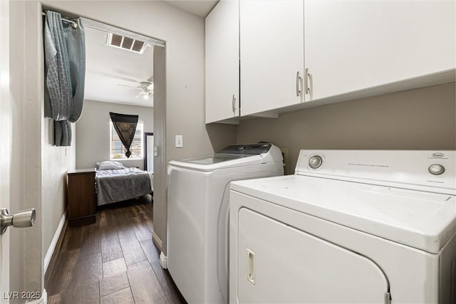 5912 Hollowridge Rd, North Las Vegas, NV 89031 - clothes washing area with washing machine and clothes dryer, cabinet space, dark wood-style flooring, baseboards, and a ceiling fan