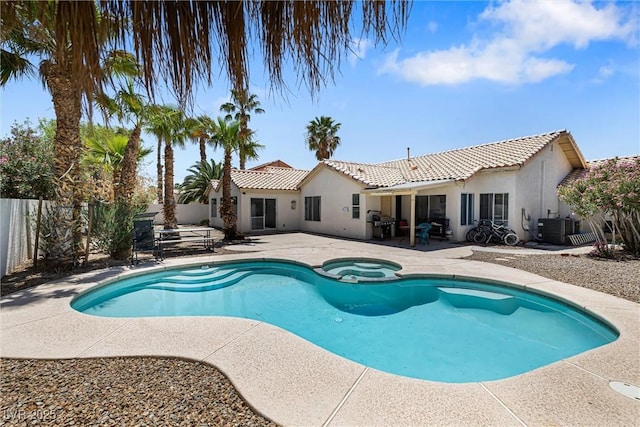 5912 Hollowridge Rd, North Las Vegas, NV 89031 - view of swimming pool featuring a patio area, fence, central air condition unit, a pool with connected hot tub, and a grill