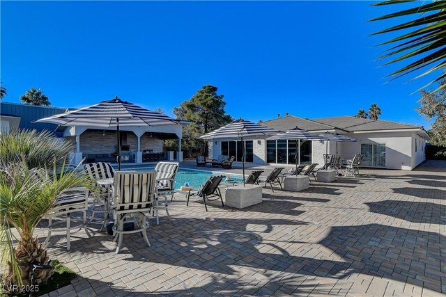 view of patio with an outdoor pool