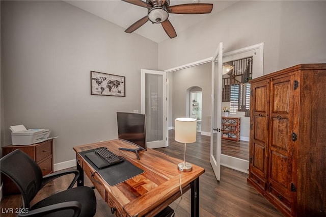 11112 Pine Greens Ct, Las Vegas, NV 89144 - office space featuring french doors, ceiling fan, dark wood-style floors, arched walkways, and baseboards