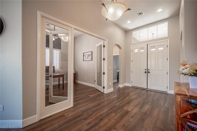 11112 Pine Greens Ct, Las Vegas, NV 89144 - foyer entrance featuring arched walkways, dark wood finished floors, french doors, baseboards, and recessed lighting