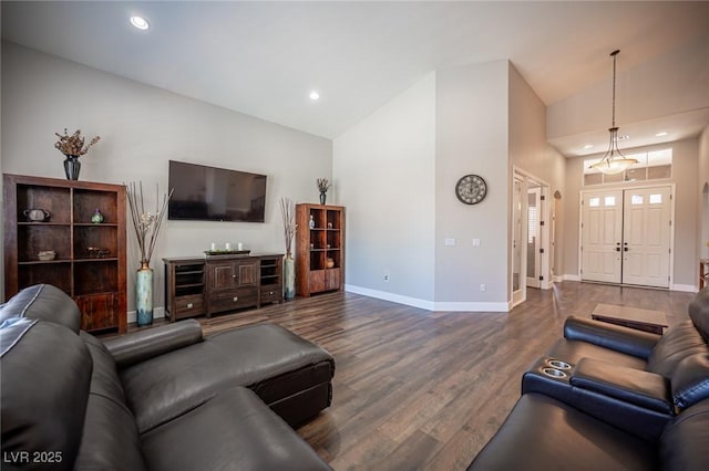 11112 Pine Greens Ct, Las Vegas, NV 89144 - living area with wood finished floors, baseboards, high vaulted ceiling, and recessed lighting
