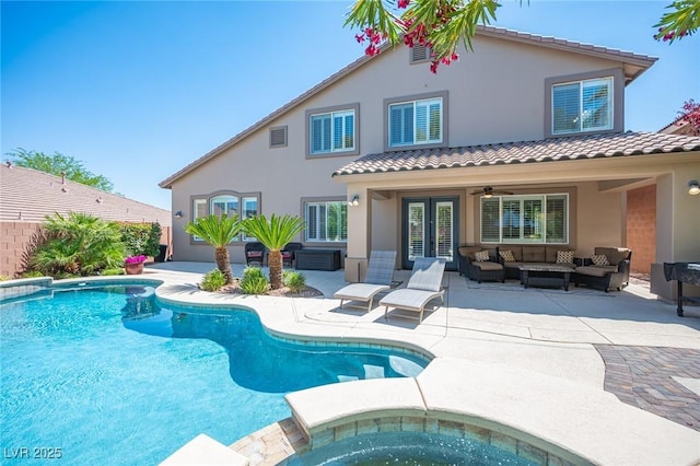 11112 Pine Greens Ct, Las Vegas, NV 89144 - view of swimming pool featuring outdoor lounge area, a patio area, a ceiling fan, french doors, and a pool with connected hot tub