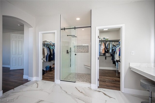 11112 Pine Greens Ct, Las Vegas, NV 89144 - full bath featuring a shower stall, baseboards, recessed lighting, marble finish flooring, and a spacious closet