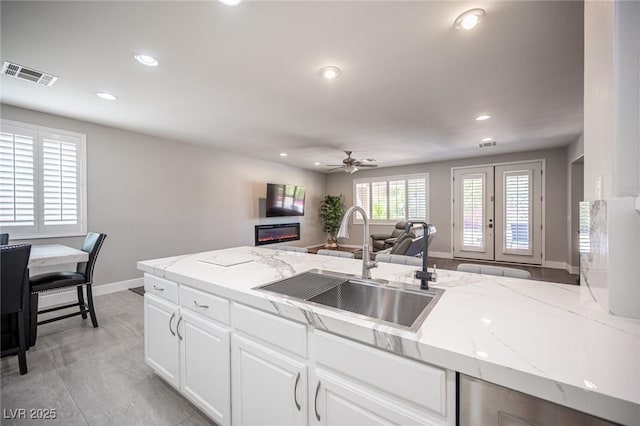 11112 Pine Greens Ct, Las Vegas, NV 89144 - kitchen featuring a sink, ceiling fan, baseboards, recessed lighting, and open floor plan