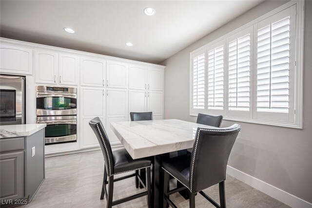 11112 Pine Greens Ct, Las Vegas, NV 89144 - dining space with recessed lighting and baseboards