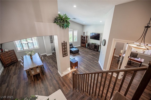 11112 Pine Greens Ct, Las Vegas, NV 89144 - staircase featuring wood finished floors, baseboards, recessed lighting, and a high ceiling