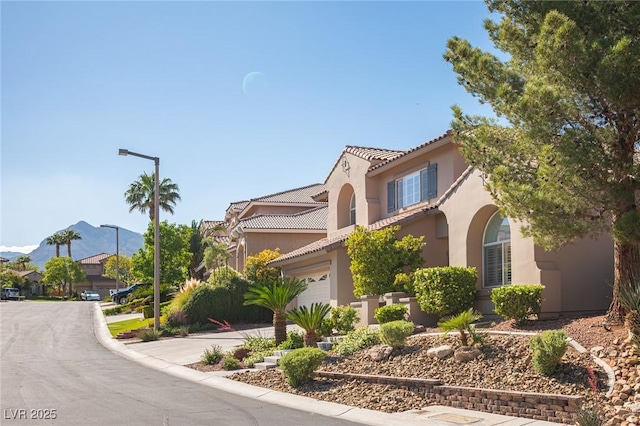 11112 Pine Greens Ct, Las Vegas, NV 89144 - mediterranean / spanish-style home featuring a tile roof, stucco siding, driveway, and a garage