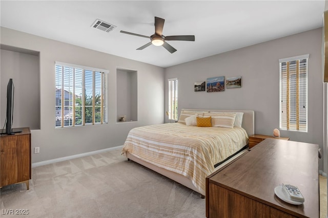 11908 Menchaca Ln, Las Vegas, NV 89138 - bedroom with multiple windows, baseboards, light carpet, and a ceiling fan