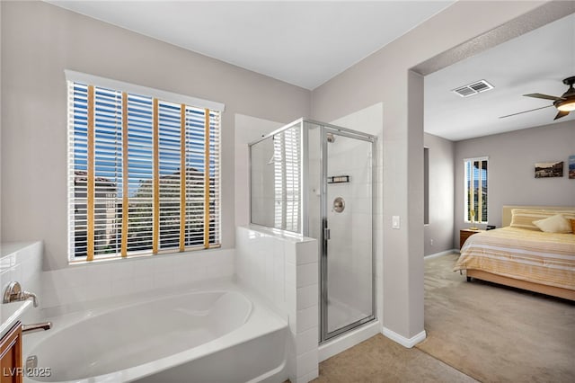 11908 Menchaca Ln, Las Vegas, NV 89138 - ensuite bathroom featuring a bath, a shower stall, a ceiling fan, baseboards, and tile patterned flooring