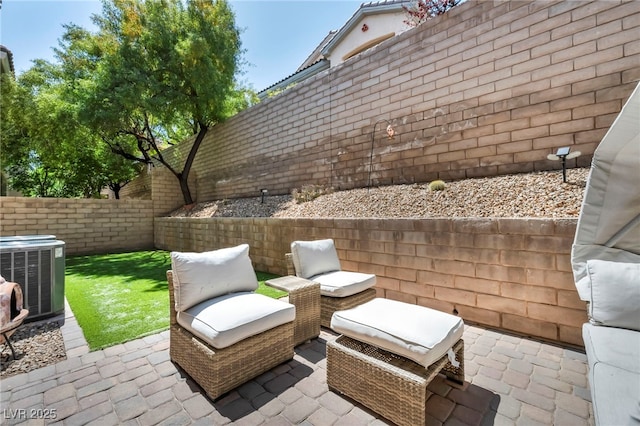 11908 Menchaca Ln, Las Vegas, NV 89138 - fenced backyard featuring a patio and central air condition unit