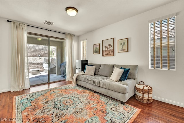 11908 Menchaca Ln, Las Vegas, NV 89138 - living room featuring baseboards and wood finished floors