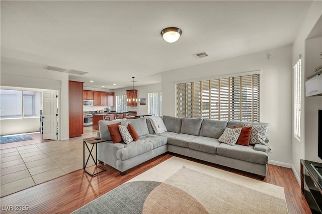 11908 Menchaca Ln, Las Vegas, NV 89138 - living area featuring light wood-style flooring, baseboards, and recessed lighting