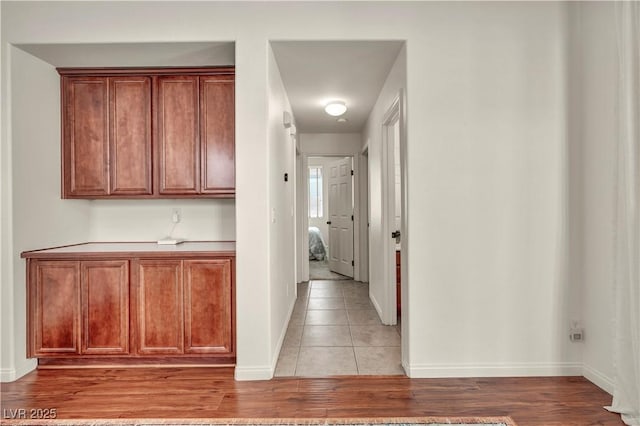 11908 Menchaca Ln, Las Vegas, NV 89138 - corridor with light wood-style flooring and baseboards