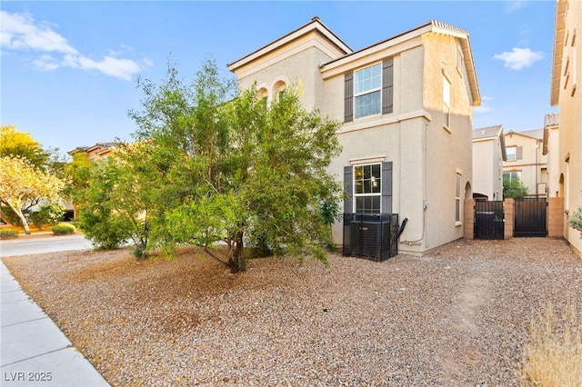 4533 Lime Straight Dr, Las Vegas, NV 89115 - view of front of house with central AC, stucco siding, a gate, and fence