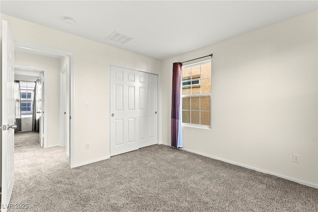 4533 Lime Straight Dr, Las Vegas, NV 89115 - unfurnished bedroom with carpet, baseboards, and a closet