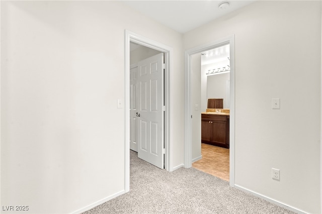 4533 Lime Straight Dr, Las Vegas, NV 89115 - corridor with light carpet and baseboards
