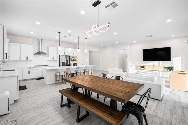 717 Monroe Hill Pl, Henderson, NV 89011 - dining area featuring recessed lighting, a chandelier, and light wood-type flooring