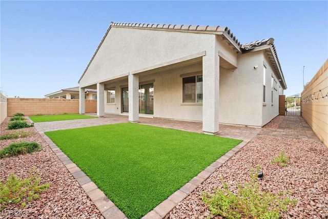 717 Monroe Hill Pl, Henderson, NV 89011 - back of property with stucco siding, a patio area, and a gate