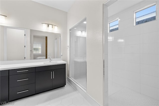 717 Monroe Hill Pl, Henderson, NV 89011 - full bathroom with tiled shower, healthy amount of natural light, vanity, and tile patterned floors