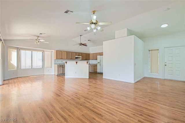 3912 Branchwood Dr, North Las Vegas, NV 89032 - unfurnished living room featuring a ceiling fan, light wood-style flooring, baseboards, and high vaulted ceiling