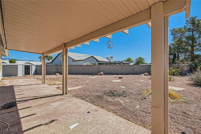 3912 Branchwood Dr, North Las Vegas, NV 89032 - fenced backyard with a storage shed, an outdoor structure, and a patio area