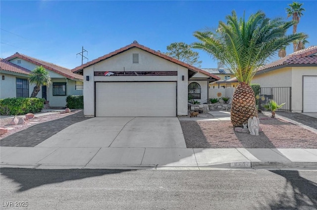 1060 Neil Armstrong Cir, Las Vegas, NV 89145 - view of front of home featuring a garage, stucco siding, concrete driveway, and a tiled roof