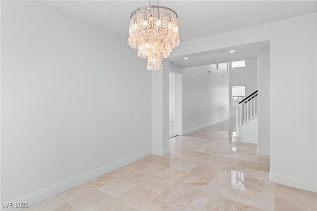 spare room with a chandelier, stairway, light marble finish floors, recessed lighting, and baseboards