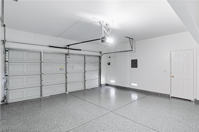 garage with a garage door opener, electric panel, and baseboards