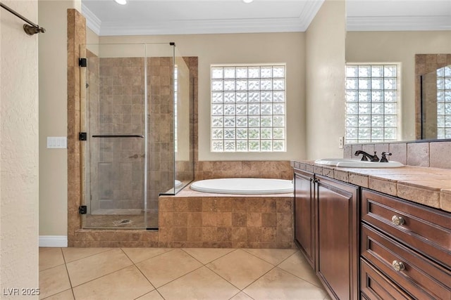 7505 Java Sparrow St, North Las Vegas, NV 89084 - bathroom with vanity, a stall shower, a bath, tile patterned flooring, and ornamental molding