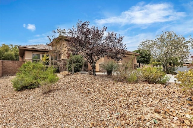 7505 Java Sparrow St, North Las Vegas, NV 89084 - obstructed view of property featuring stucco siding