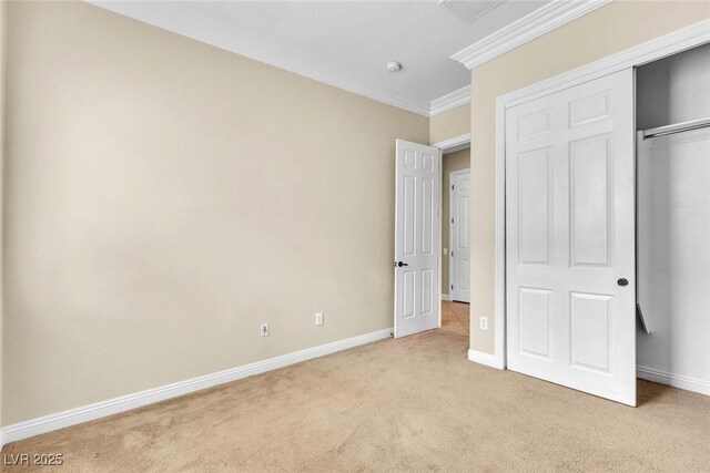 7505 Java Sparrow St, North Las Vegas, NV 89084 - unfurnished bedroom featuring light carpet, baseboards, crown molding, and a closet