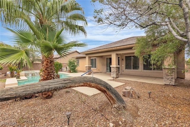 7505 Java Sparrow St, North Las Vegas, NV 89084 - rear view of house featuring stucco siding and a patio