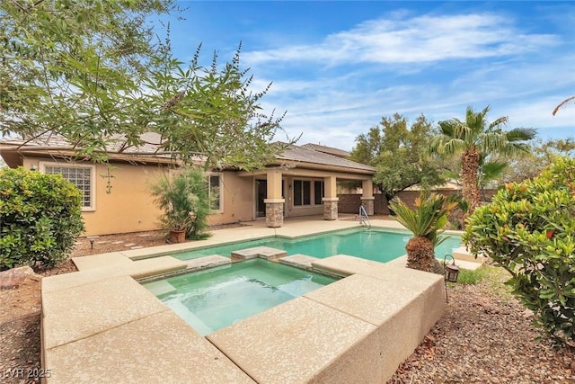 7505 Java Sparrow St, North Las Vegas, NV 89084 - view of pool featuring a pool with connected hot tub, a patio area, and a fenced backyard