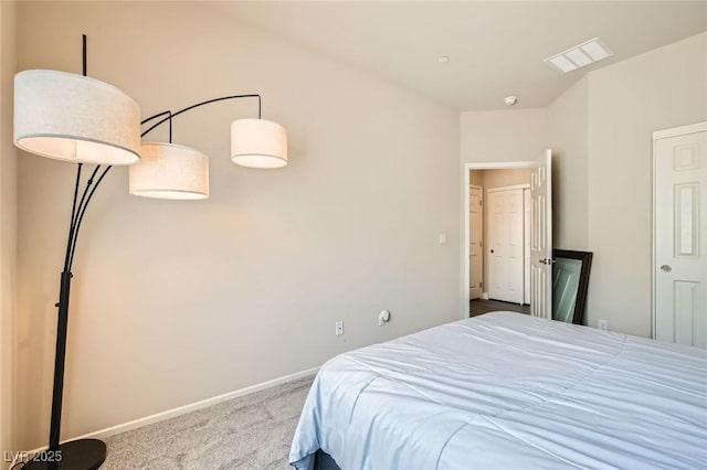 bedroom featuring carpet floors and baseboards