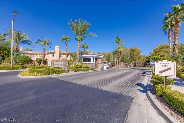 437 Pinnacle Heights Ln, Las Vegas, NV 89144 - view of asphalt street with curbs and a gated entry